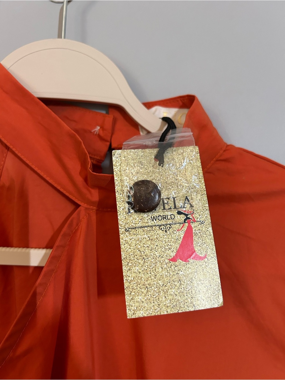 Lizette Collection One-Shoulder Asymmetrical Peplum Blouse in Orange - Picture 6 of 9
